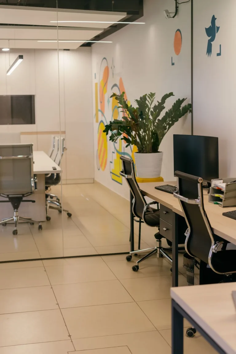 Modern office interior with glass partitions and meeting rooms