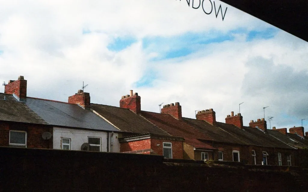 Row of Victorian stone houses with chimneys in Edinburgh