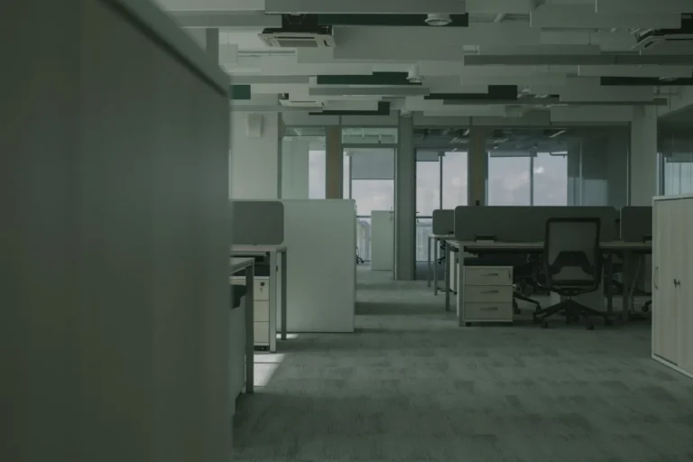 Empty open plan office with desks, chairs and partitions ready for an office move