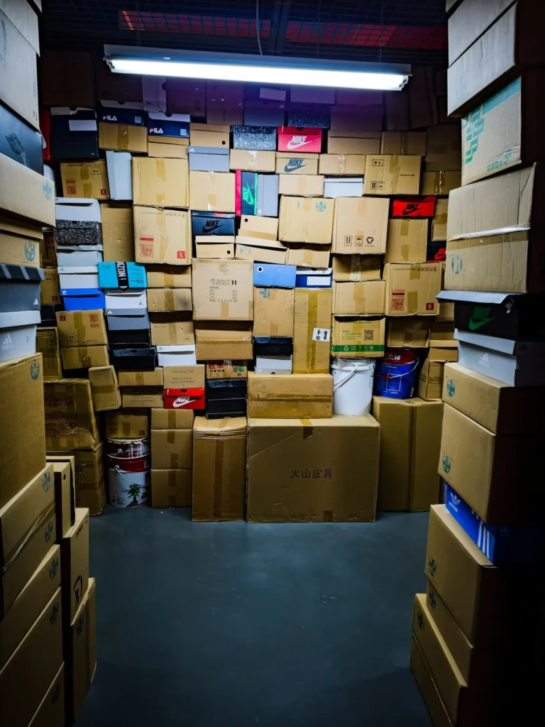 Stacked cardboard moving boxes packed and taped ready for a removal