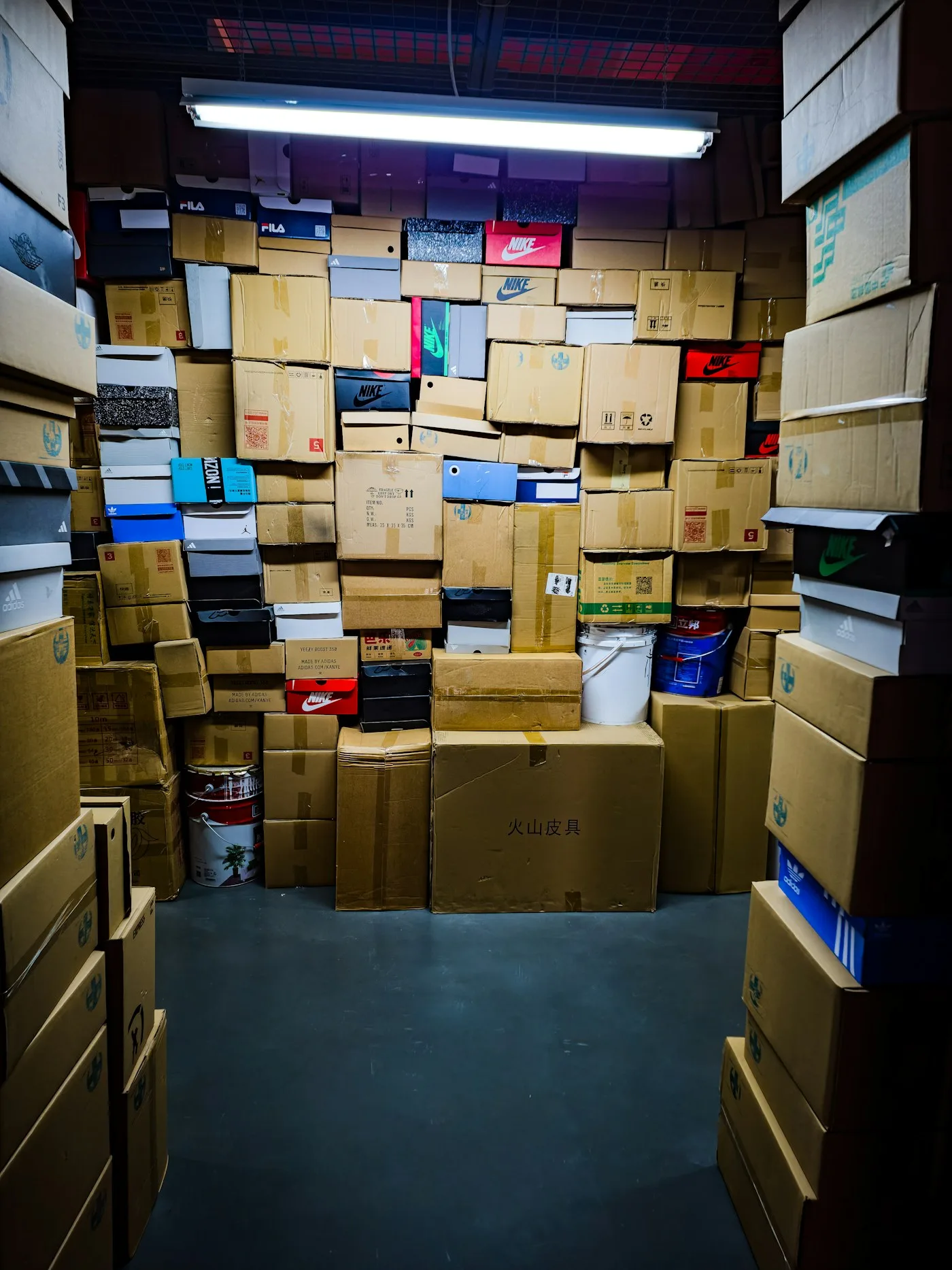 Stacked cardboard moving boxes packed and taped ready for a removal