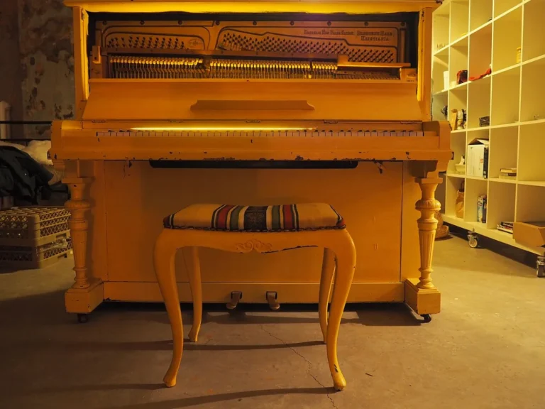 An upright piano standing against a wall