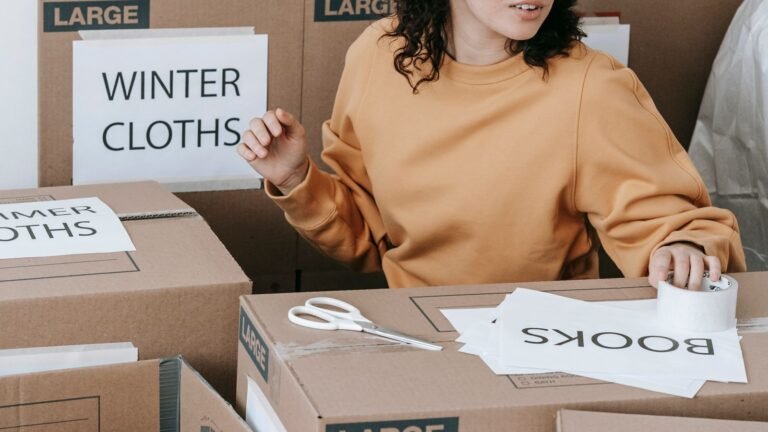 Boxes being labelled during a house clearance