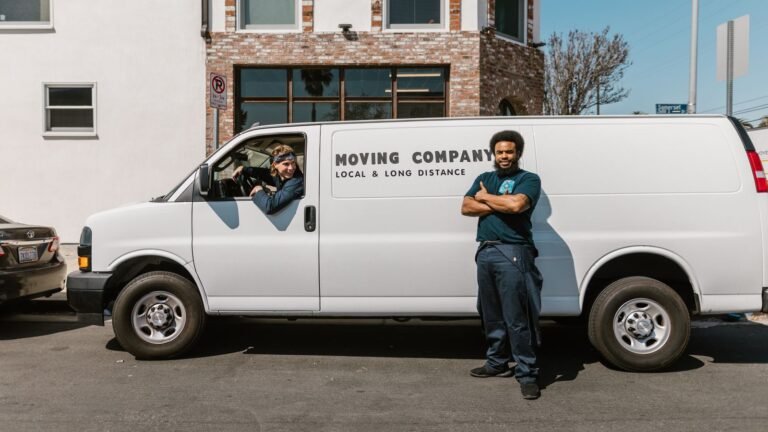 Removals crew beside a van on a city street