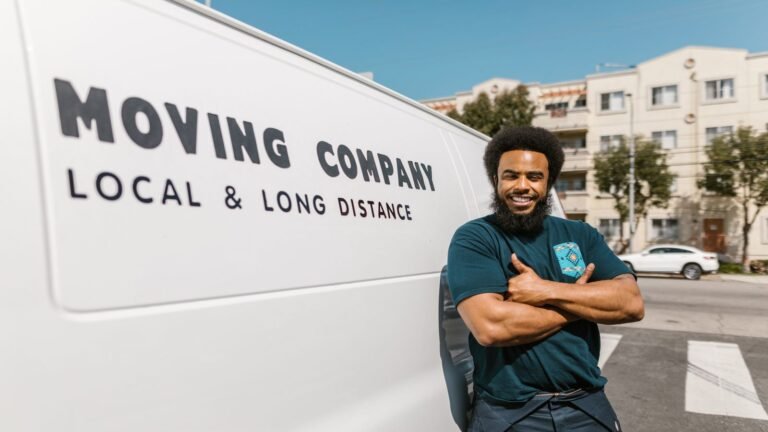 Mover standing beside a removals van